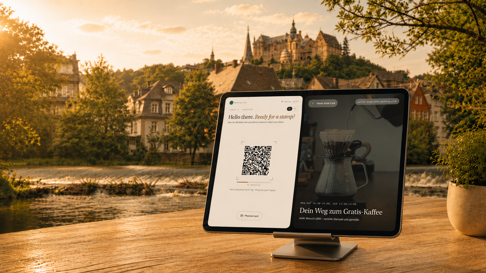 The Marburg.Club partner setup — tablet, loyalty QR and standees on a café counter overlooking the old town
